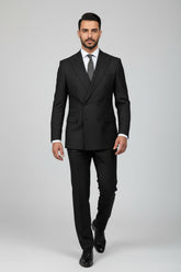 Man wearing black pinstripe double-breasted suit, tailored for formal occasions.